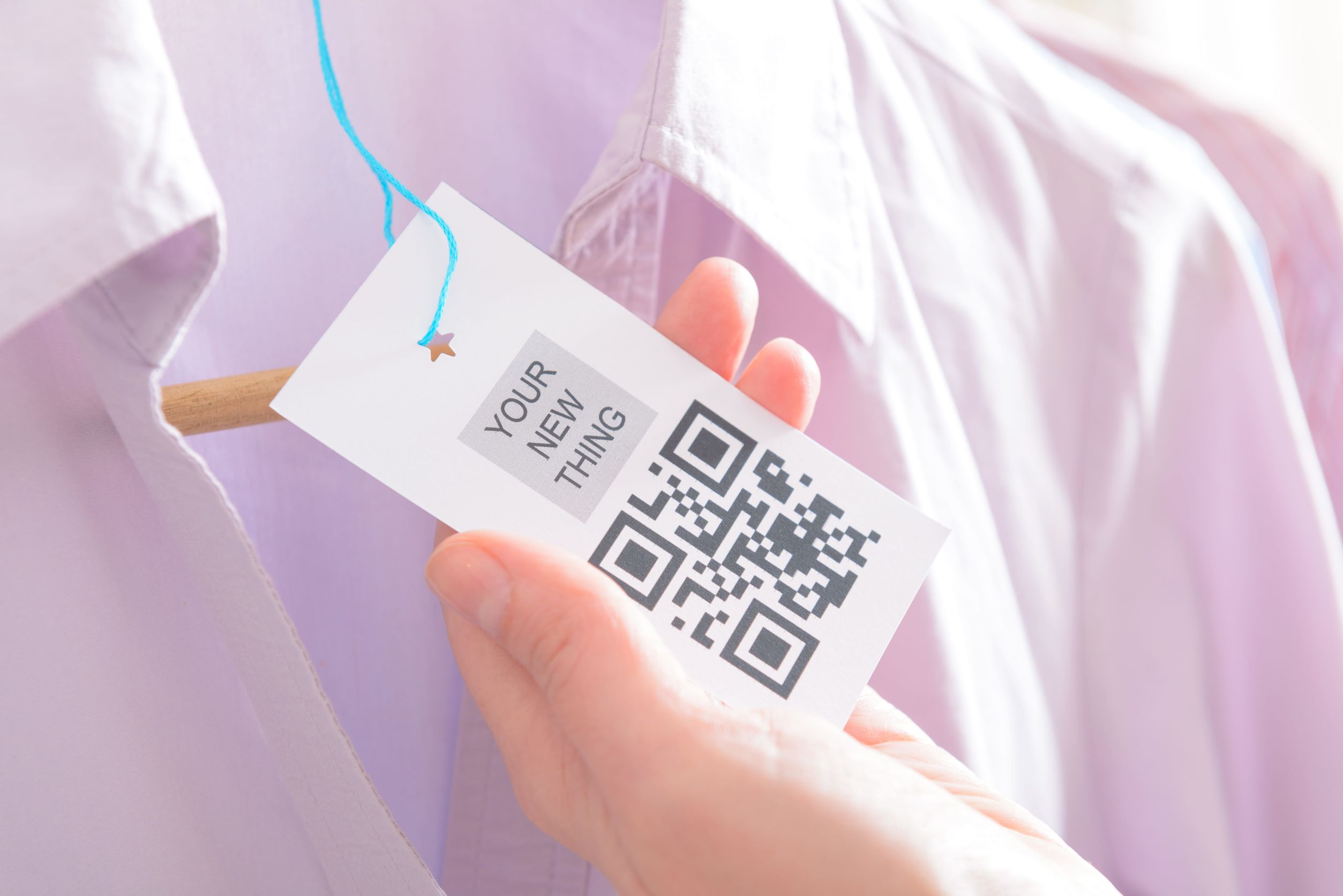 woman's hands with a qr code